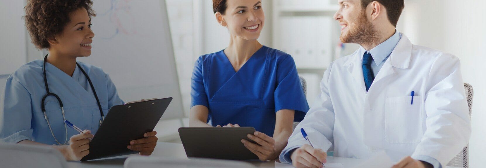 Health Information Management professionals at a meeting.