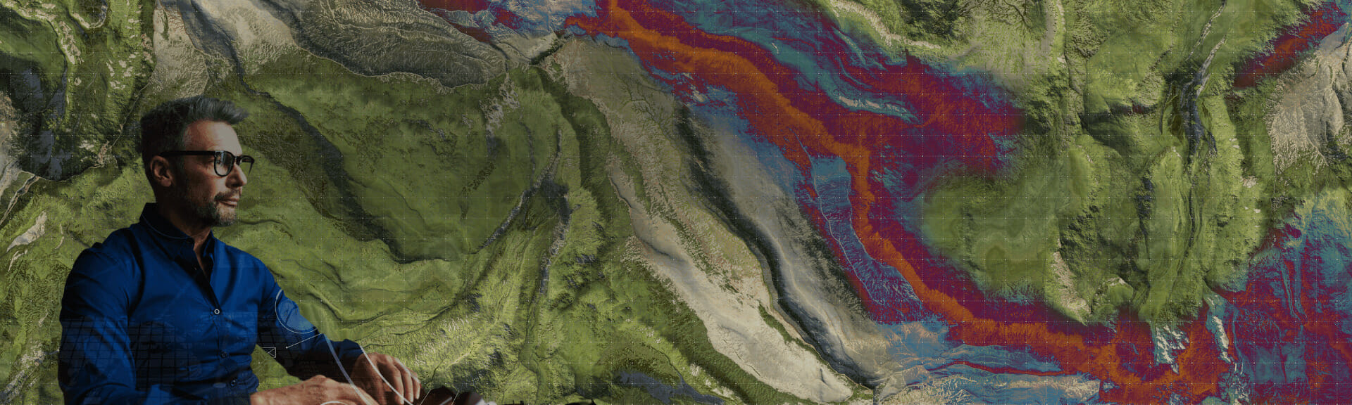 Geographic information systems expert studying terrain map.