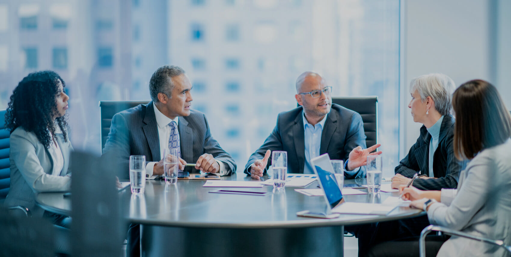 Health Administrators in a meeting having a roundtable discussion.