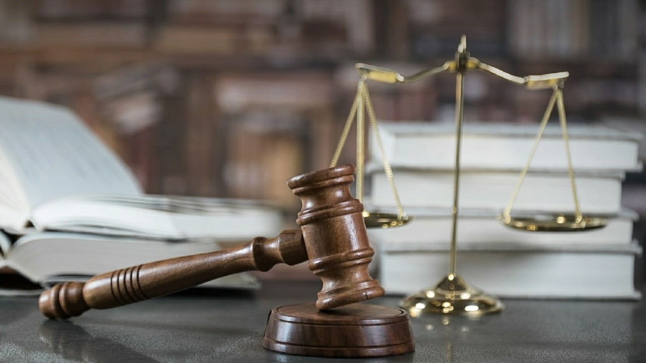 Law and Justice concept. Mallet of the judge, books, scales of justice.  Courtroom theme.